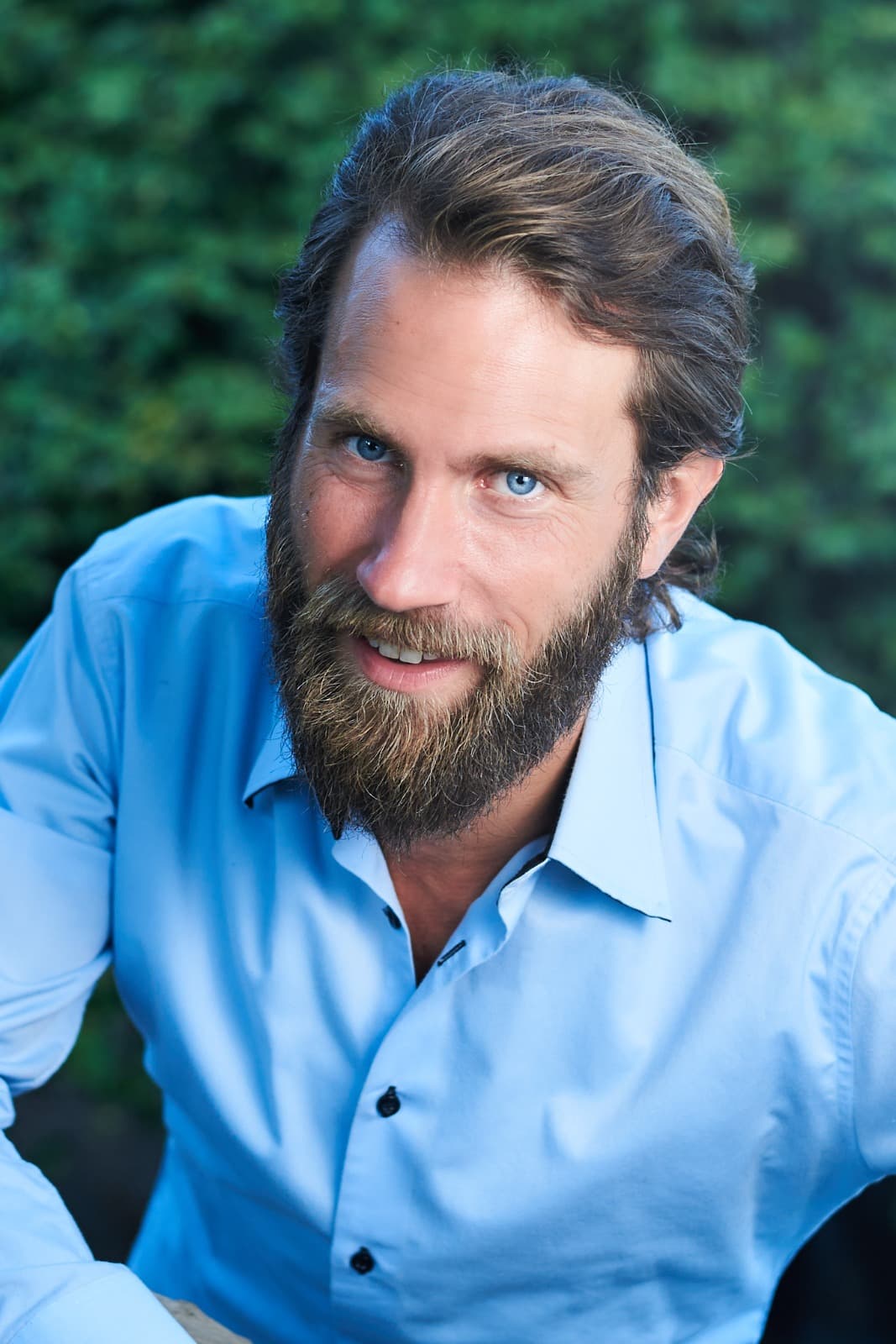Entrepreneur standing at viewpoint overlooking Pula amphitheatre