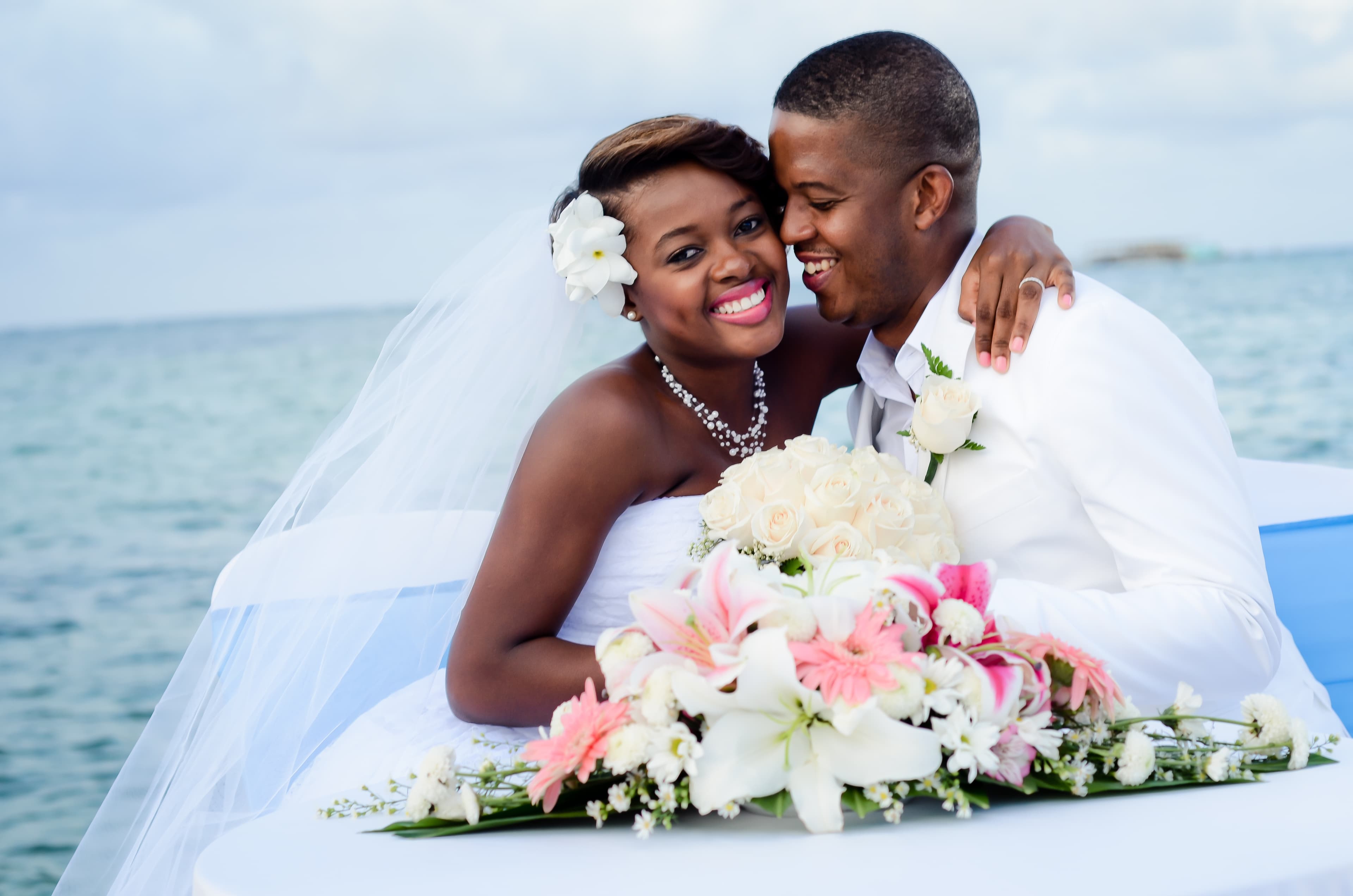 Bride and groom walking through a vineyard at dusk in golden Istrian light