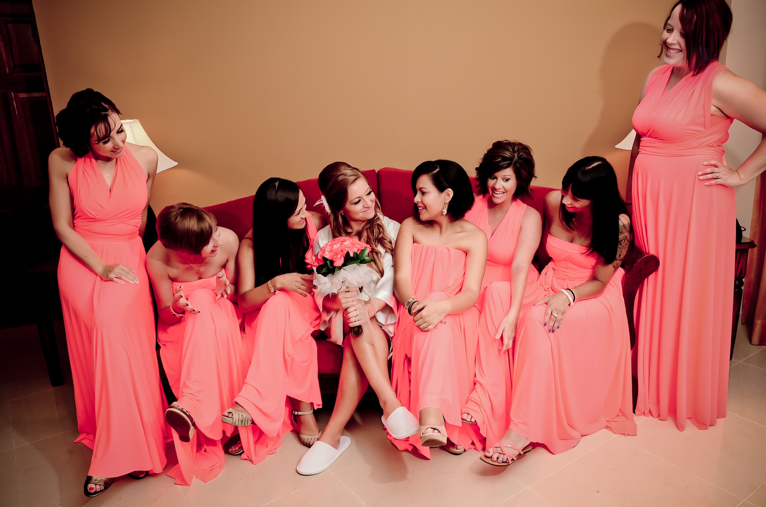 Bride and groom walking through a vineyard at dusk in golden Istrian light