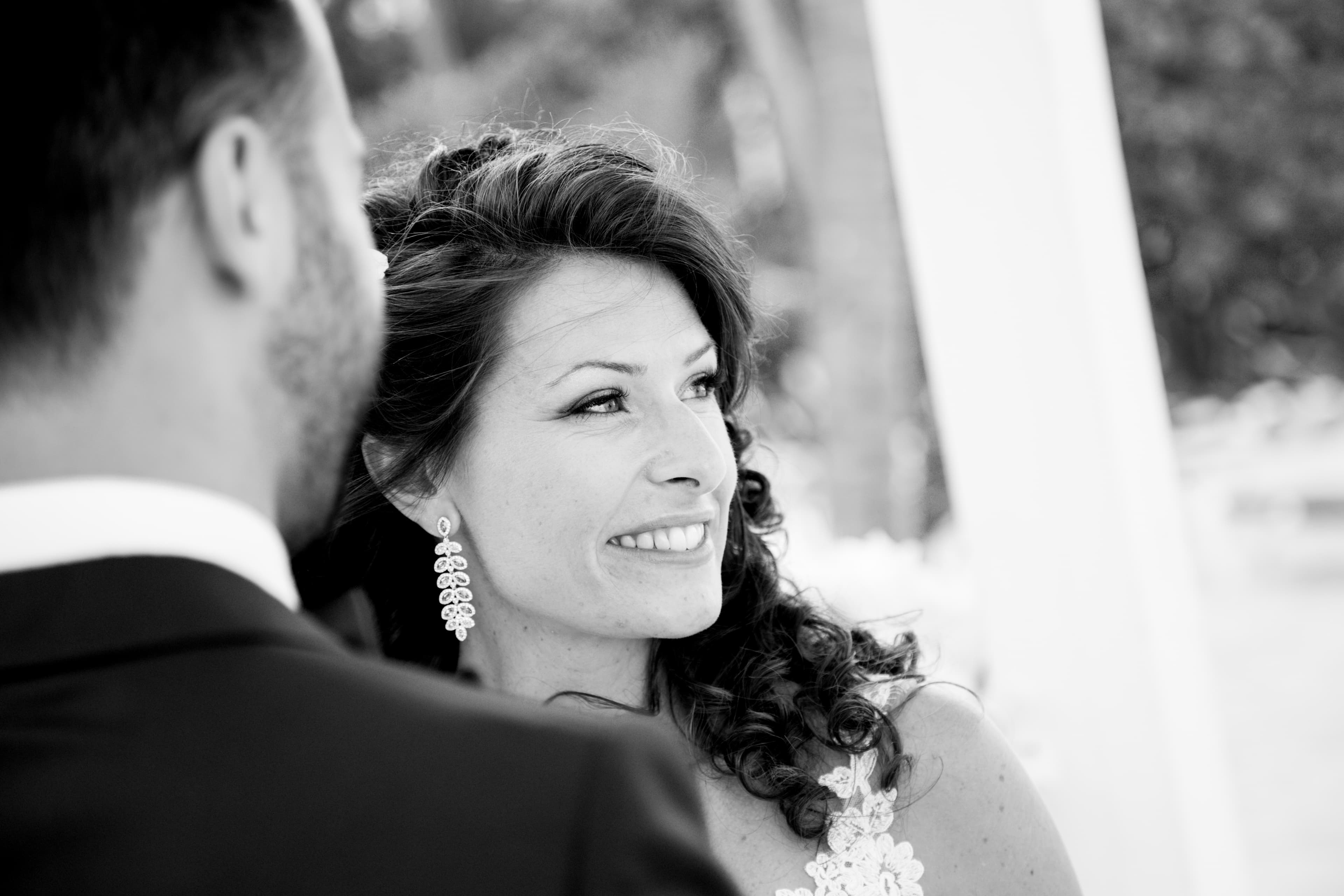 Bride and groom walking through a vineyard at dusk in golden Istrian light