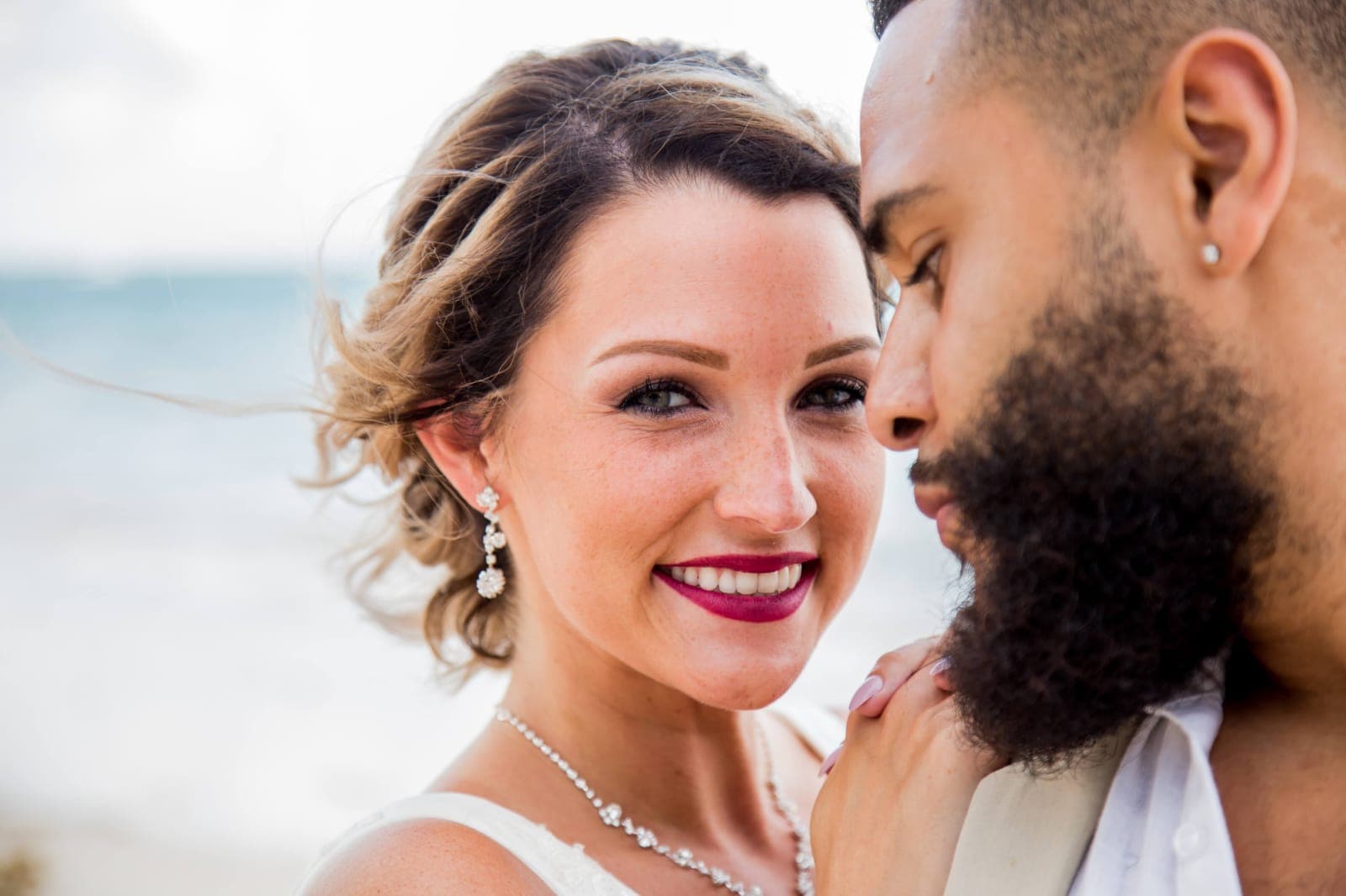 Bride and groom walking through a vineyard at dusk in golden Istrian light