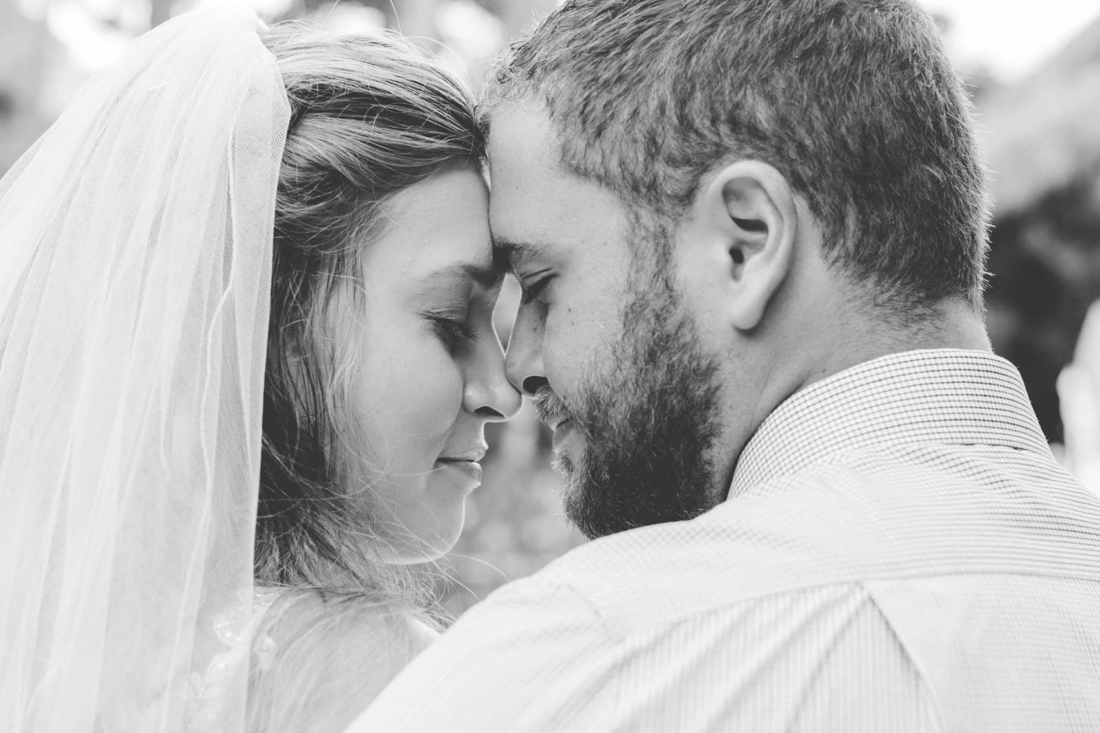 Bride and groom walking through a vineyard at dusk in golden Istrian light